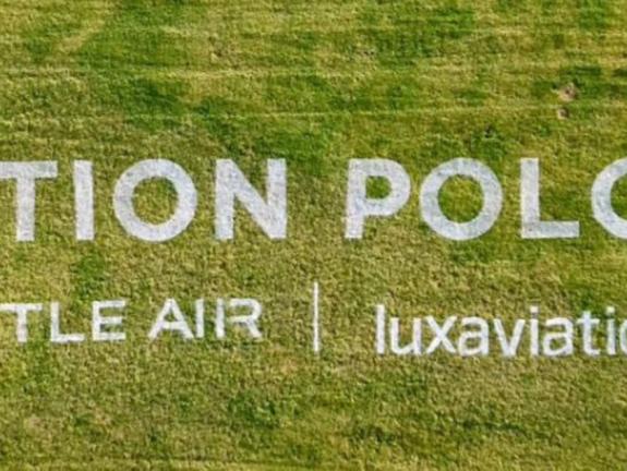 Aerial photo of 45m wide Aviation Polo Cup logo stencilled on grass