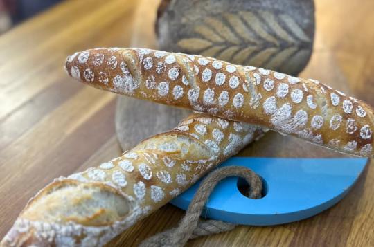 2 baguettes and loaf of real bread with stencil decoration