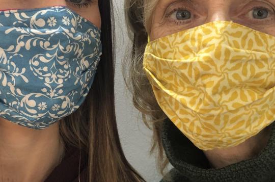 Custom face masks in blue and gold with floral patterns