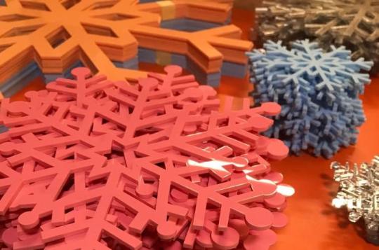 Laser cut snowflakes from a range of materials including felt, suede and acrylic