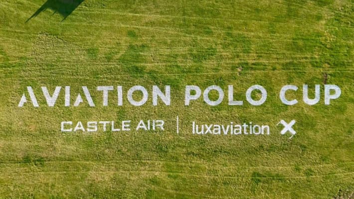 Aerial photo of 45m wide Aviation Polo Cup logo stencilled on grass