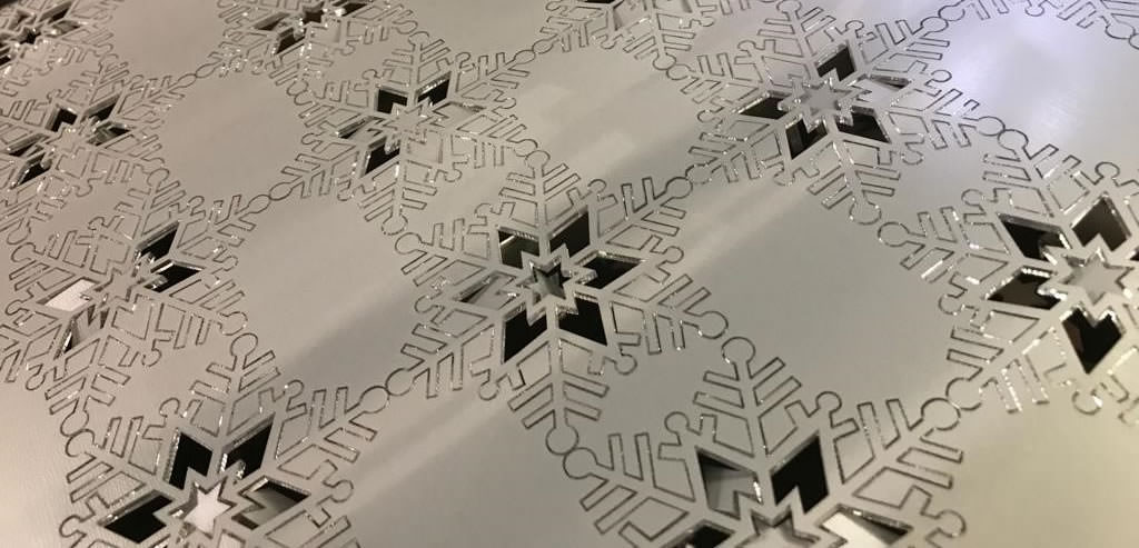 Laser cut metallic snowflakes for Christmas display